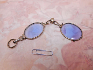 A lorgnette with blue tinted lenses. 19thc