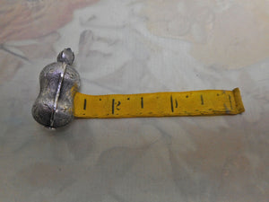 A bright cut engraved silver tape measure. c 1840