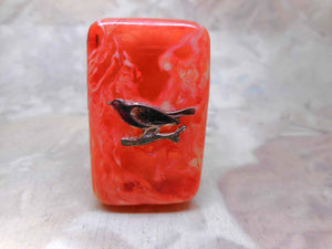 SOLD…..A celluloid case for a thimble applied with a robin. c 1920