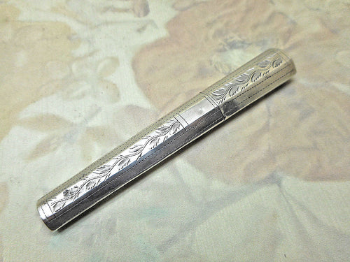 An engraved silver bodkin case. c 1800 Wardell & Kempson.