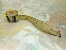 Load image into Gallery viewer, SOLD……A mother of pearl &#39;bandstand&#39; tape measure. c 1850.
