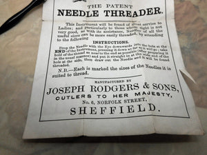 A Joseph Rodgers needle threader with original advert. 19thc