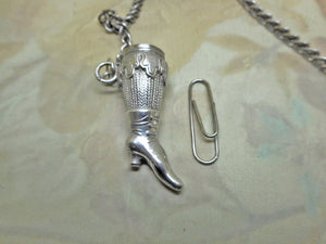 SOLD……A pair of silver knitting needle ends -lady's stockinged legs. Late 19thc