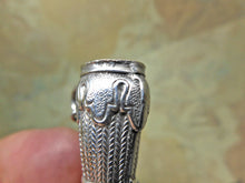 Load image into Gallery viewer, SOLD……A pair of silver knitting needle ends -lady&#39;s stockinged legs. Late 19thc
