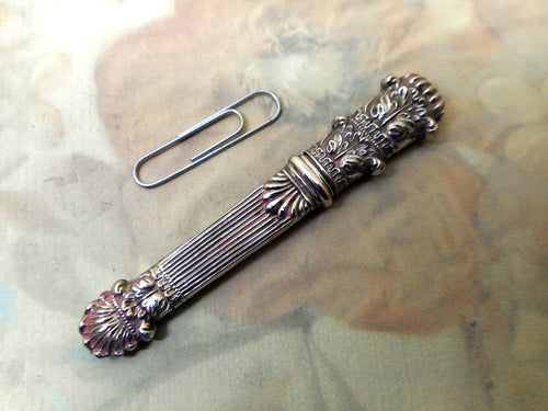 An antique embossed silver needle case. c 1830-1840