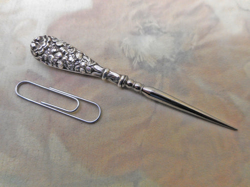 An embossed silver stiletto / awl.  English c 1830