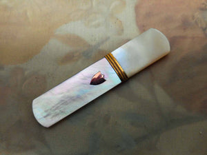 SOLD…………….A French mother of pearl needle case with gold shield. Palais Royal c 1800.
