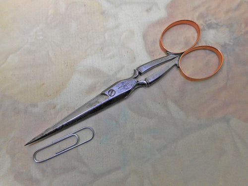 A pair of gold handled steel scissors. Leuchars.