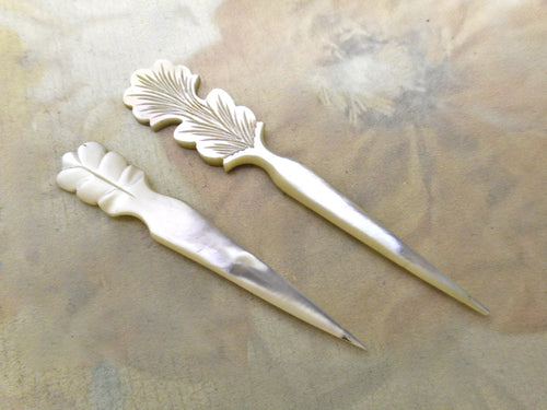 Two mother of pearl stilettos / awls.