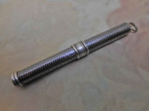 SOLD…..A silver cedar pencil holder with blackened niello decoration. c 1930