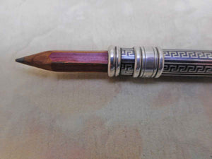 SOLD…..A silver cedar pencil holder with blackened niello decoration. c 1930