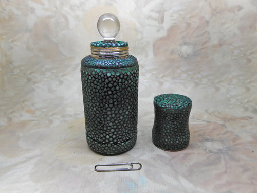 A glass scent bottle in a shagreen case. c 1920