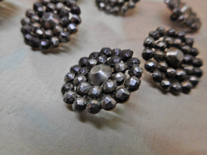 SOLD……Nine small buttons with riveted steel studs. c 1840.