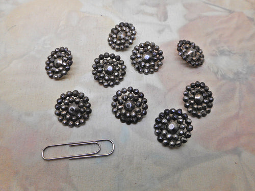 Nine small antique steel buttons. 19thc