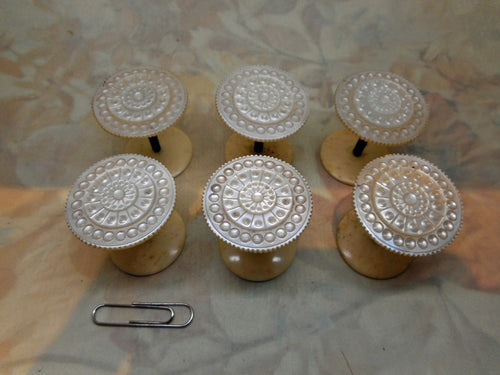 A set of 6 antique pearl topped cotton reels / spools