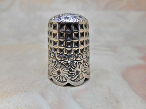 A very pretty hall marked silver thimble. Chester 1892