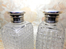 Load image into Gallery viewer, A pair of cut-glass scent bottles with screw on silver lids. c 1860
