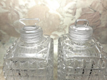 Load image into Gallery viewer, A pair of cut-glass scent bottles with screw on silver lids. c 1860
