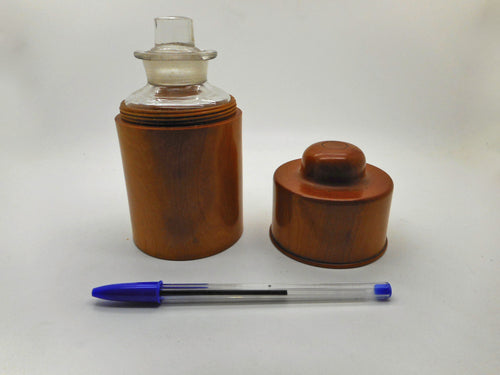 A wooden holder with its medicine bottle.  Late 19thc Treen