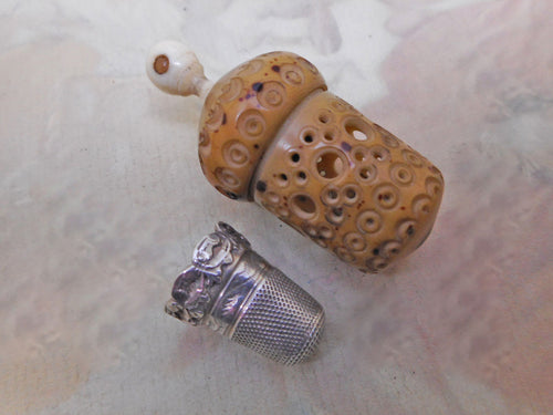 A antique thimble case with view of Runcorn and a silver thimble