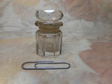 Load image into Gallery viewer, A small antique smelling salts bottle.
