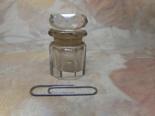 A small antique smelling salts bottle.