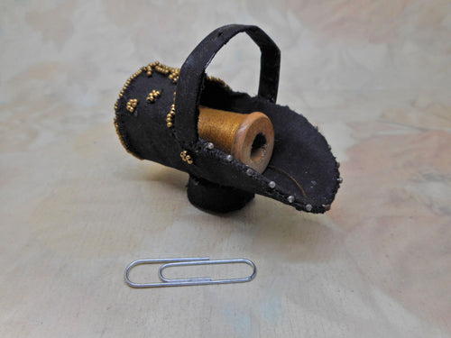 A hand made 'coal scuttle' spool holder.