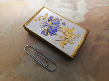 Load image into Gallery viewer, A card needle packet box with an embossed flower. c 1860
