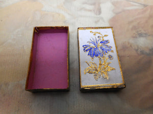 A card needle packet box with an embossed flower. c 1860