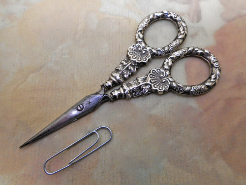 A pair of Regency silver handled scissors with shell handles. c 1835