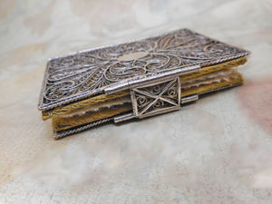 SOLD………A silver filigree book cover with its silk needle case.  c 1800