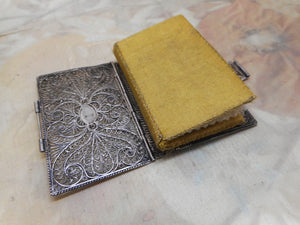 SOLD………A silver filigree book cover with its silk needle case.  c 1800