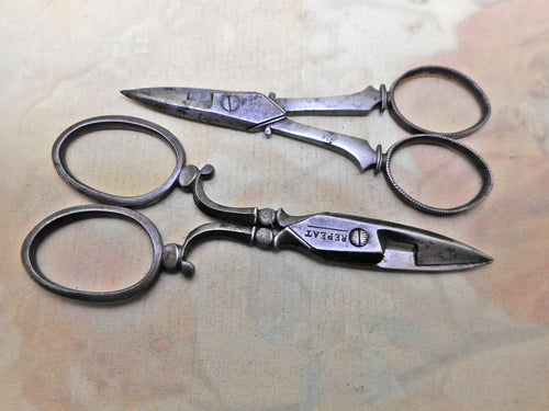 Two pairs of old steel scissors. 19thc