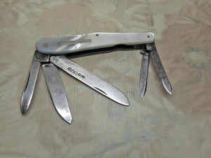 A multi bladed penknife which also includes a silver folding blade. 1922