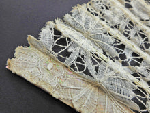 Load image into Gallery viewer, SOLD…….A lace fan with pearl sticks and hanging loop. 19thc
