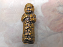 Load image into Gallery viewer, A brass match safe / vesta in the form of a baby. c 1900-1920
