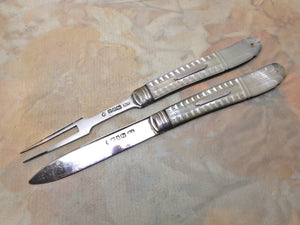 An antique folding fruit knife and fork with pearl sleeves. HM. 1843 /1844.