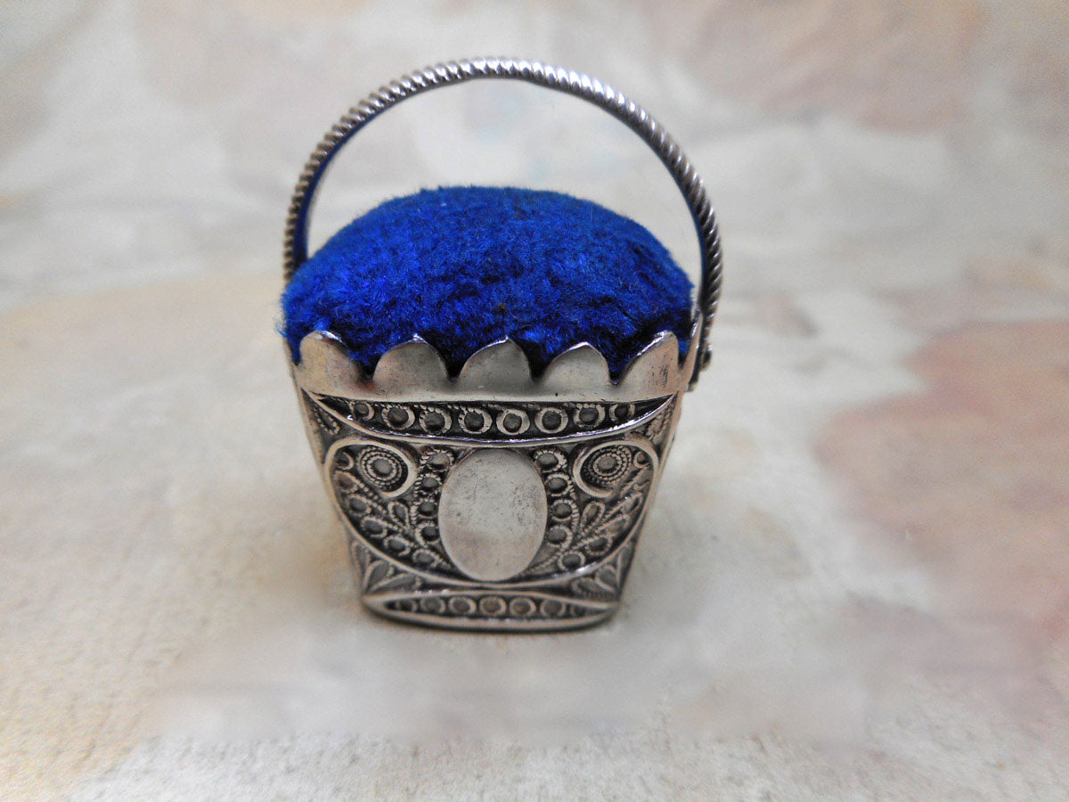 SOLD........A 'blind filigree' pin cushion in the form of a basket. T & P maker. c 1830-1840