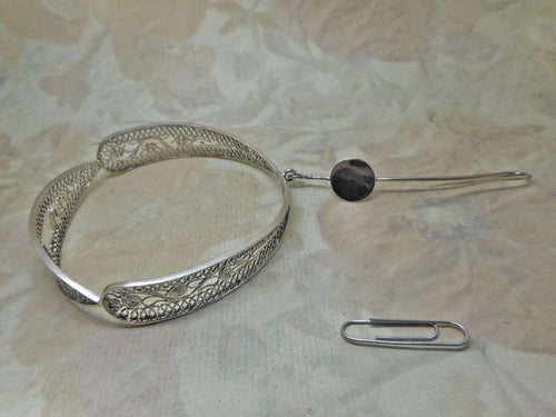 A 19th century Dutch silver filigree bangle and wool hook.