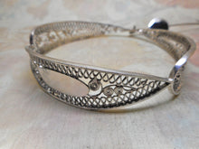 Load image into Gallery viewer, A 19th century Dutch silver filigree bangle and wool hook.
