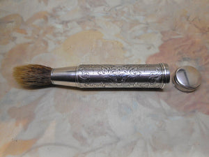 An engraved silver shaving brush. London 1859