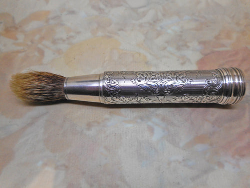 An engraved silver shaving brush. London 1859