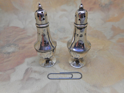 A pair of antique miniature silver pepperettes, 1897