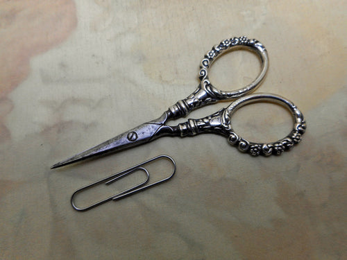 A pair of small sterling silver handled scissors. c 1900