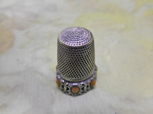 Charger l&#39;image dans la galerie, A German silver thimble with coral coloured beading. Late 19th century.
