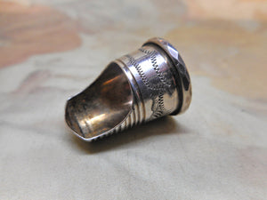 A silver finger guard / thimble. c 1840-1860