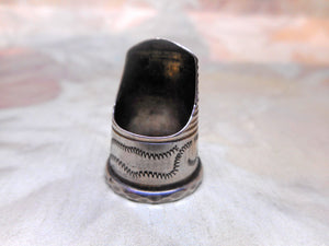 A silver finger guard / thimble. c 1840-1860