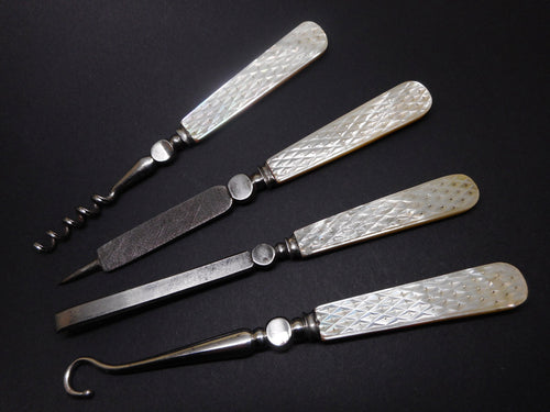 A set of four top quality mother of pearl hand tools. c1840