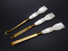 Load image into Gallery viewer, Three gilt steel hand tools with pearl handles. c 1870
