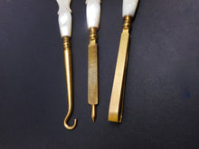 Load image into Gallery viewer, Three gilt steel hand tools with pearl handles. c 1870
